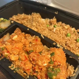 Pink Buddha bento box with spicy garlic chicken and fried rice