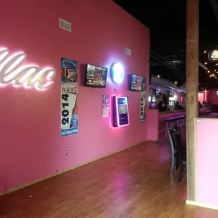 a neon sign in a pink room