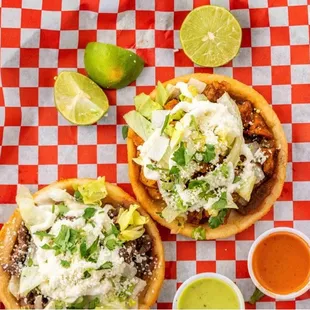 Sopes are one of the most famous street food items in Central and Southern Mexico. Thick tortilla with meat, lettuce, cheese and dressings.