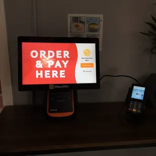 No snackpass, but order onsite at a kiosk