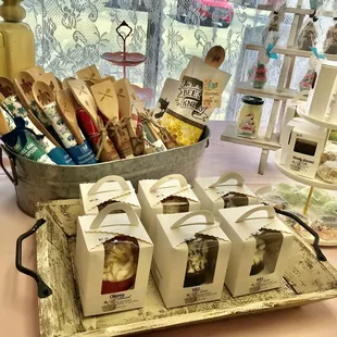 a display of wooden spoons and utensils