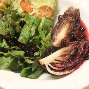 Radicchio, grilled, with blueberries (reduced in a vinaigrette) and served with farm greens. All vegetables from the Pink Elephant Farm.