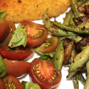 Cherry tomatos, basil (raw), green beans and onions (stir fried). Showing some of the season variety/change of vegetables from a local farm