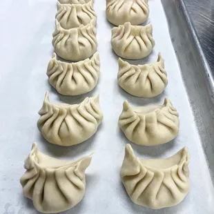 dumplings on a baking sheet