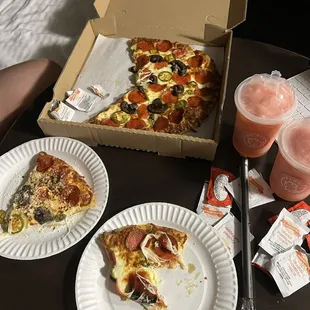 12&quot; Pepperoni Whole Pizza with jalapeños and mushrooms and two pink lemonade slush drinks.