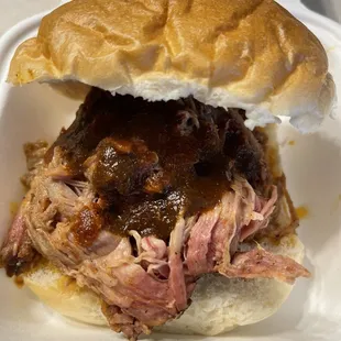Smoked Pulled Pork sandwich with BBQ and Reaper sauce