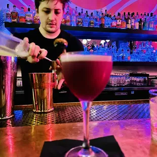 Cam, our bartender, mixing cocktails