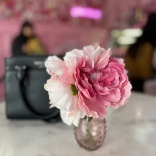 pink and white flowers in a glass vase