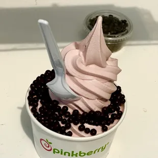 a cup of ice cream with a spoon