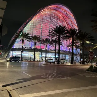 the exterior of a building lit up at night