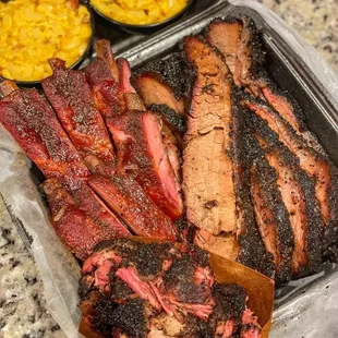 Brisket, Pork Ribs, Chopped Beef and Mac and Cheese! (IG: @featuredbites )