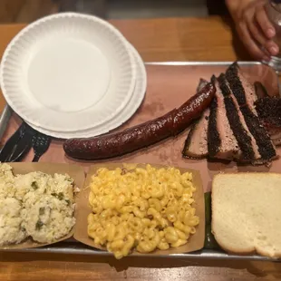 Jalapeño sausage, marbled brisket, jalapeño rice, and bacon Mac and cheese