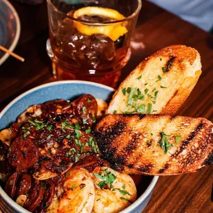 a bowl of shrimp and bread