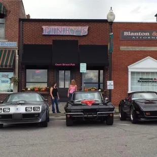 three cars parked in front of the building