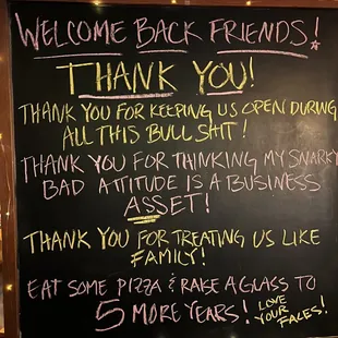 a blackboard with a sign that says welcome back friends thank you