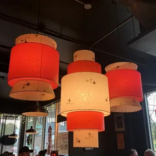 red and white lamps hanging from the ceiling