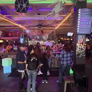 a group of people at a bar