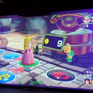 Mario Party being played on projector