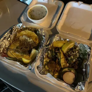 two trays of food on a table