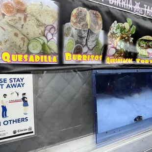 a food truck with a menu on it