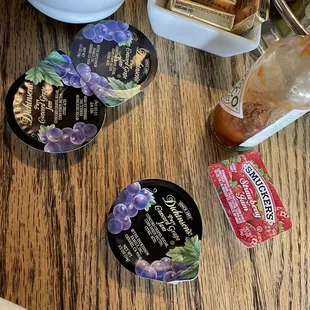 a bowl of soup, a bowl of ice cream, and a plate of cookies on a table