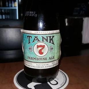 a bottle of beer on a coaster