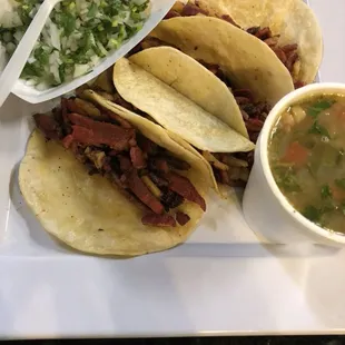 a plate of tacos and a bowl of soup