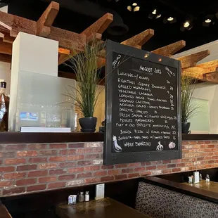 a menu on the wall of a restaurant