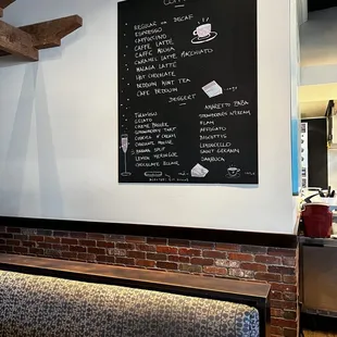 a menu on the wall of a restaurant