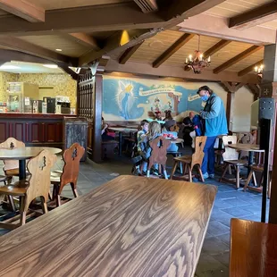 a dining area with tables and chairs