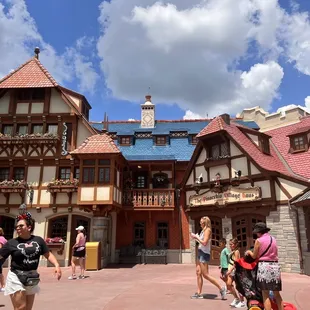 people walking in front of a building