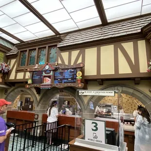 a man standing in front of a bar