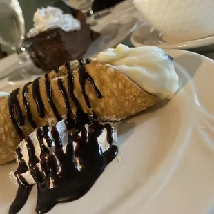 a dessert with ice cream and chocolate sauce