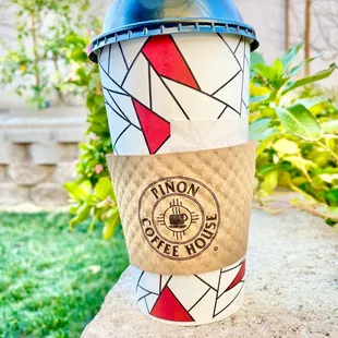 a coffee cup on a rock