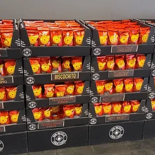 a display of orange and yellow cupcakes