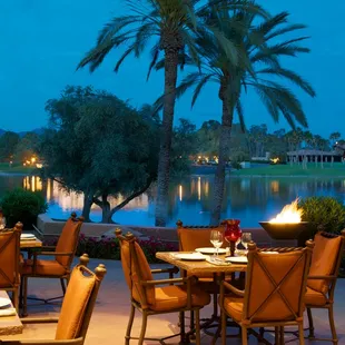 a view of a lake and palm trees