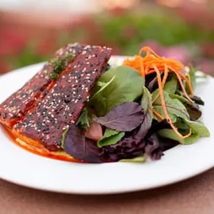 a plate of food with a salad
