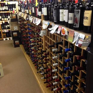 rows of wine bottles in a store