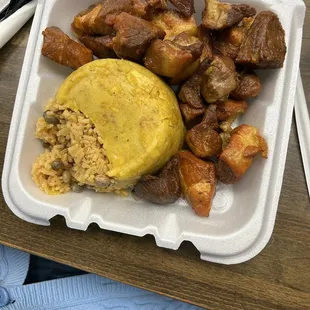 Is the 50/50 half mofongo half arroz con gandules y masa&apos;s de puerco fritas
