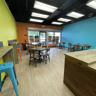 a restaurant with tables and chairs