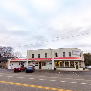 cars parked in front of the restaurant