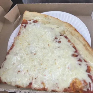 a slice of pizza in a box
