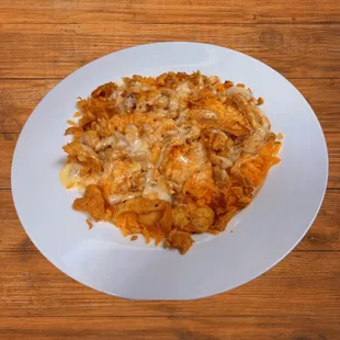 a plate of food on a wooden table