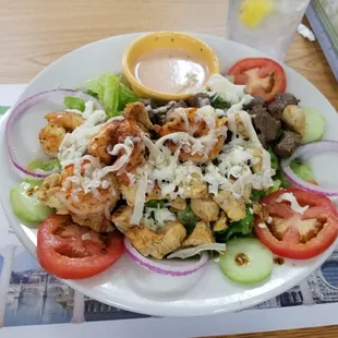 Miggy''s salad with chicken, steak and shrimp. Yummy. The housemade dressings are very good.