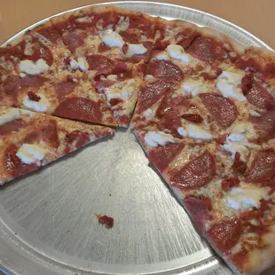 Two slices gone but, this pizz is called the rustica and it was so good!
