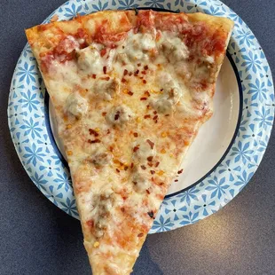 a slice of pizza on a plate