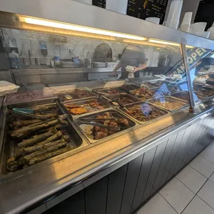 The other end of where the food it. To the left of the photo is where the cashier is.