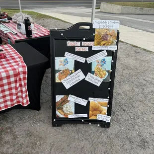 a table set up with a menu board