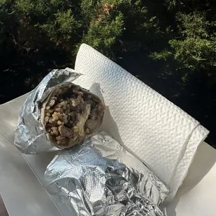 Breakfast burrito with fried rice, egg, and pork adobo