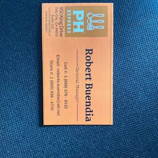 a business card on a blue chair